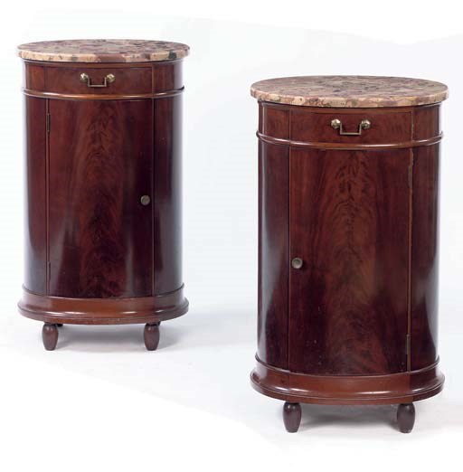A PAIR OF NORTH EUROPEAN MAHOGANY BEDSIDE CUPBOARDS
