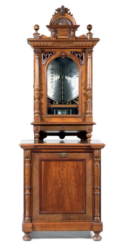 A GERMAN FIGURED-WALNUT UPRIGHT POLYPHON WITH FOURTY-THREE 50 CM DISCS