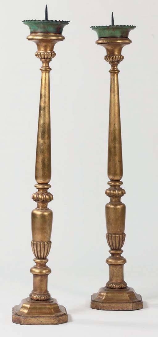 A MATCHED PAIR OF NORTH EUROPEAN GILTWOOD AND BRONZED PRICKET CANDLESTICKS