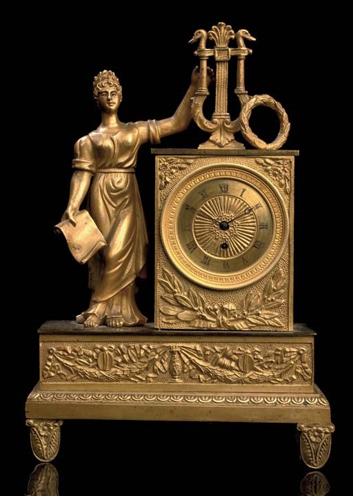 A SMALL ORMOLU FIGURAL TIMEPIECE