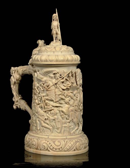 A RELIEF CARVED IVORY TANKARD