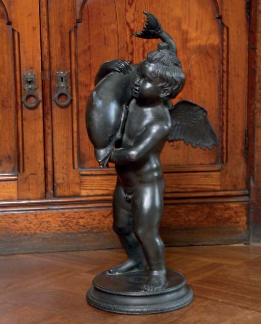 A NEAPOLITAN BRONZE GROUP OF CUPID HOLDING A DOLPHIN