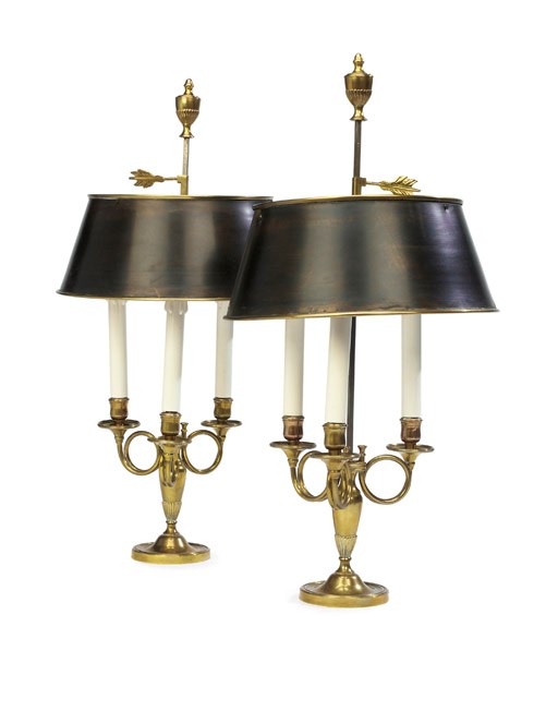 A PAIR OF FRENCH GILT-BRONZE AND BRONZED TOLE THREE-LIGHT LAMPES BOUILLOTTE