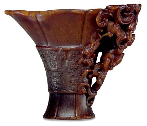 **AN ARCHAISTIC RHINOCEROS HORN LIBATION CUP