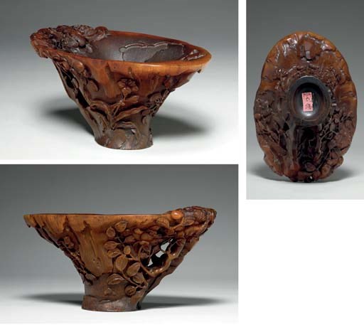 **A RARE AND FINELY CARVED RHINOCEROS HORN LIBATION CUP