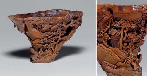 **A FINELY CARVED RHINOCEROS HORN LIBATION CUP