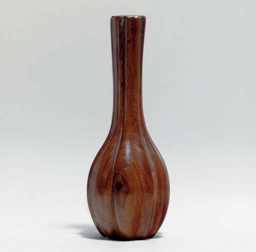 A SMALL HUANGHUALI LOBED BOTTLE VASE
