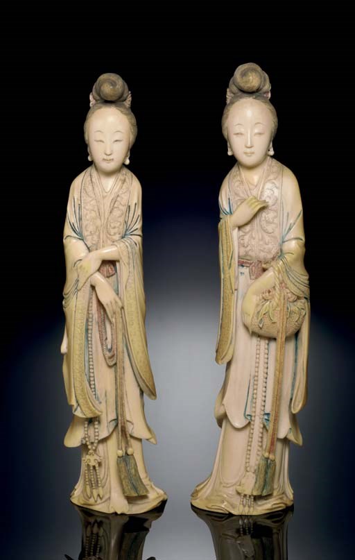 **A PAIR OF PAINTED IVORY FIGURES OF MAIDENS