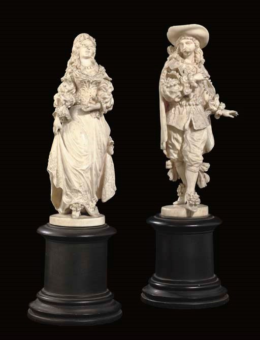 A PAIR OF DIEPPE CARVED IVORY FIGURES OF A SEVENTEENTH CENTURY COUPLE