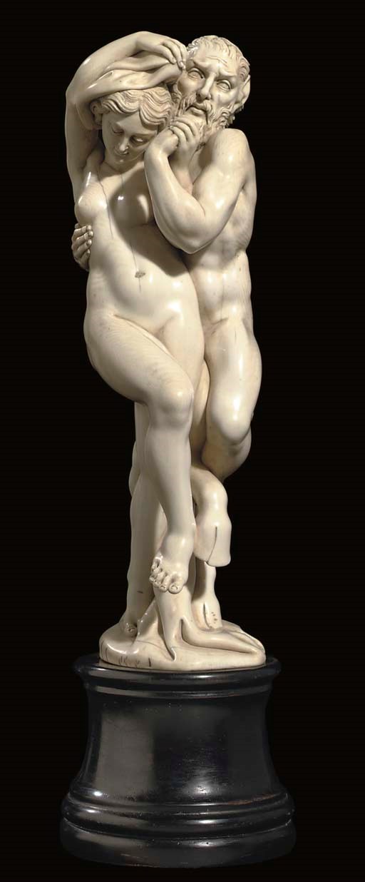 A GERMAN IVORY GROUP OF PAN AND A MAIDEN