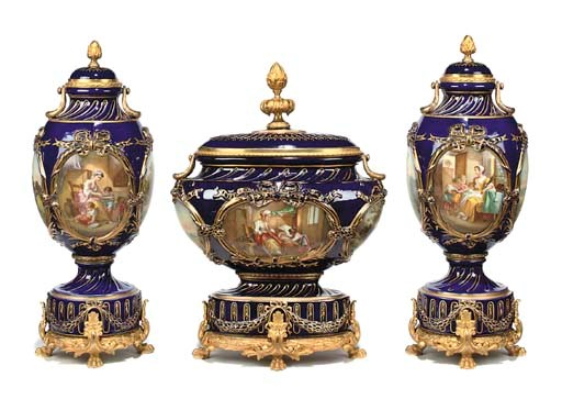 AN ORMOLU-MOUNTED SEVRES STYLE COBALT-BLUE-GROUND PORCELAIN THREE-PIECE GARNITURE