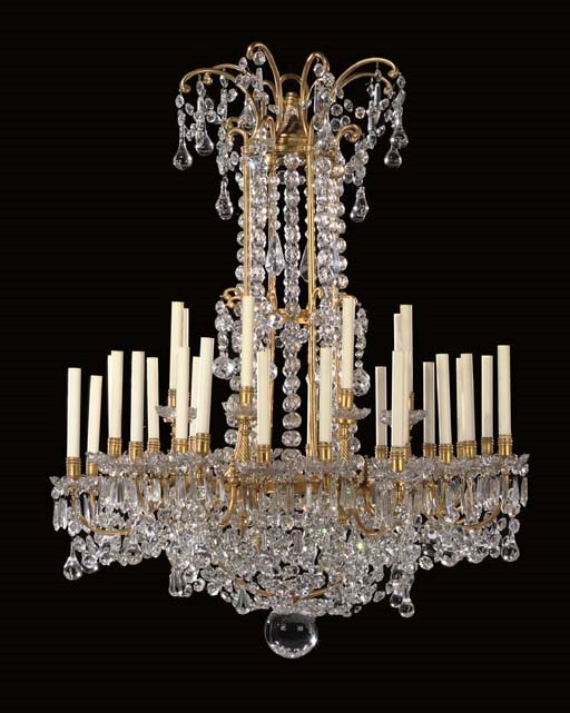 A LOUIS XVI STYLE ORMOLU AND CUT GLASS THIRTY-TWO-LIGHT CHANDELIER