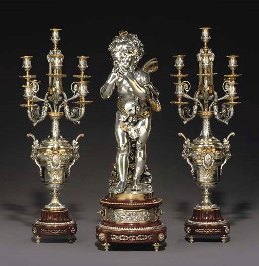 A NAPOLEON III SILVERED-BRONZE AND ORMOLU-MOUNTED ROUGE GRIOTTE MARBLE THREE-PIECE GARNITURE