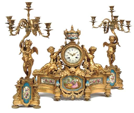 A NAPOLEON III ORMOLU-MOUNTED SEVRES STYLE TURQUOISE-GROUND PORCELAIN-MOUNTED THREE-PIECE GARNITURE