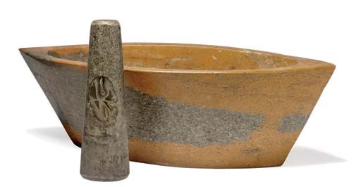 A stone eye-shaped mortar and pestle