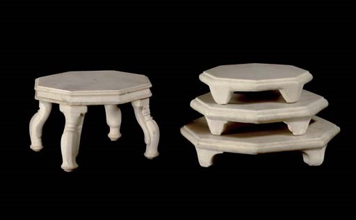 A group of four marble stools