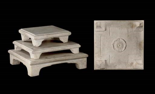 A group of four marble stools