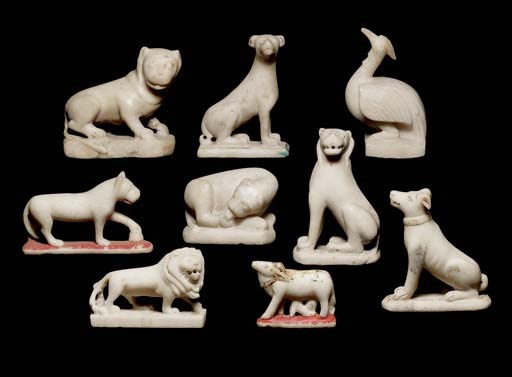 A group of nine marble animals