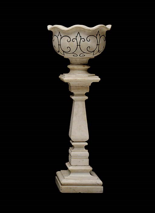 A tall marble jardiniere