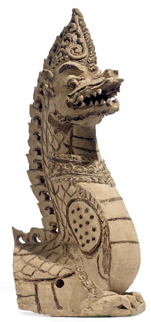 A glazed stoneware figure of a Naga