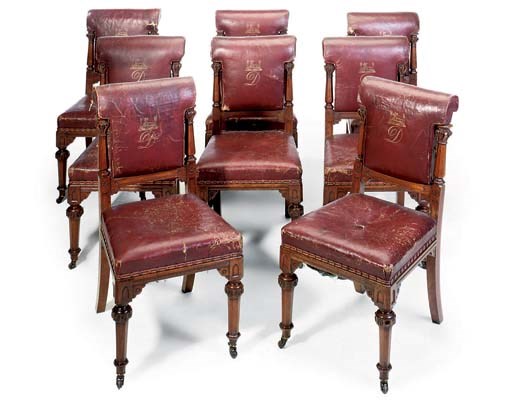 A SET OF EIGHT VICTORIAN WALNUT AND LEATHER CHAIRS
