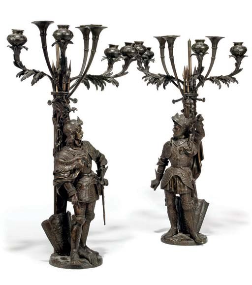 A PAIR OF BRONZE SEVEN-LIGHT CANDELABRA