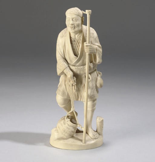 A Japanese ivory okimono of a fisherman, signed Isshin, 19th Century