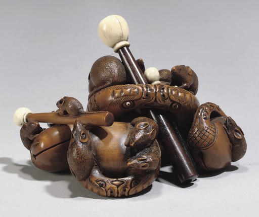 A Japanese boxwood and ivory rat and mokugyo bells okimono, 19th century