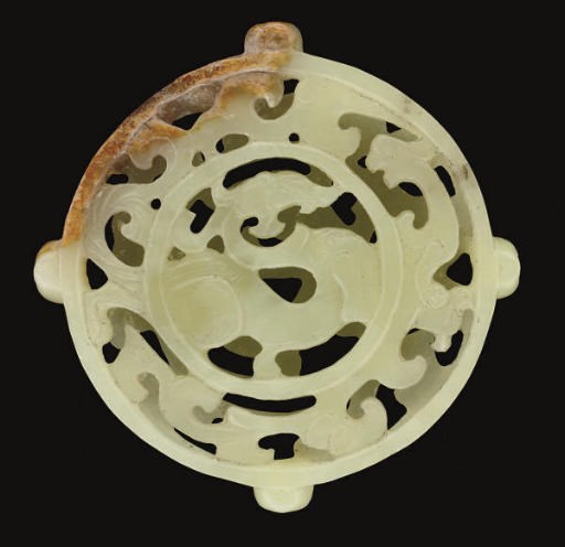 A Chinese yellow and russet jade archaistic reticulated double-disc, 20th century
