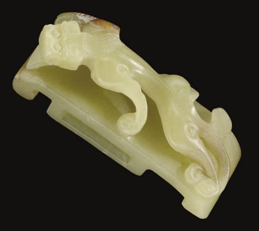 A Chinese yellow jade sword slide, 19th century