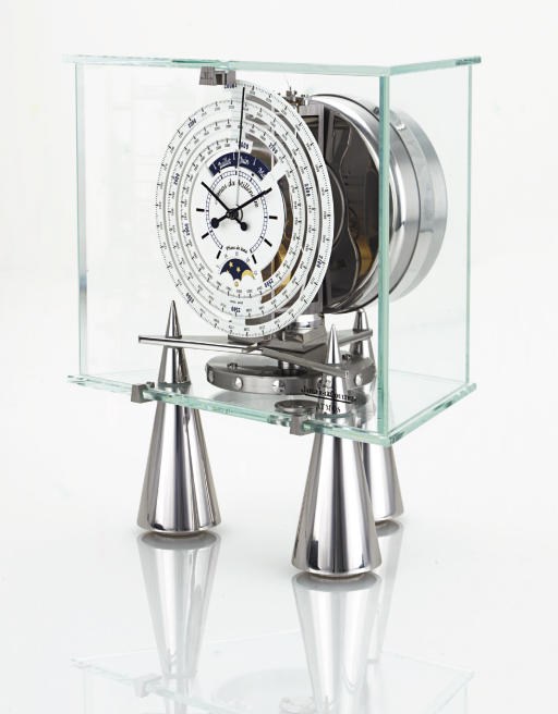 JAEGER-LECOULTRE. A STAINLESS STEEL AND GLASS BAROMETRIC-DRIVEN CLOCK WITH 1000 YEAR CALENDAR AND PHASES OF THE MOON