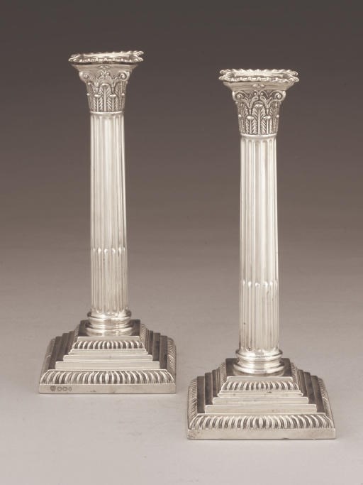 A MATCHED PAIR OF LATE VICTORIAN SILVER CORINTHIAN COLUMN CANDLESTICKS