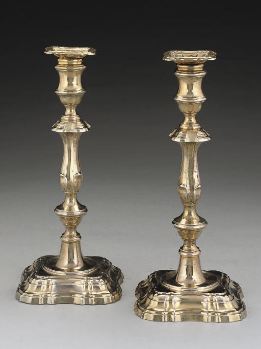 A MATCHED PAIR OF SILVER-GILT CANDLESTICKS