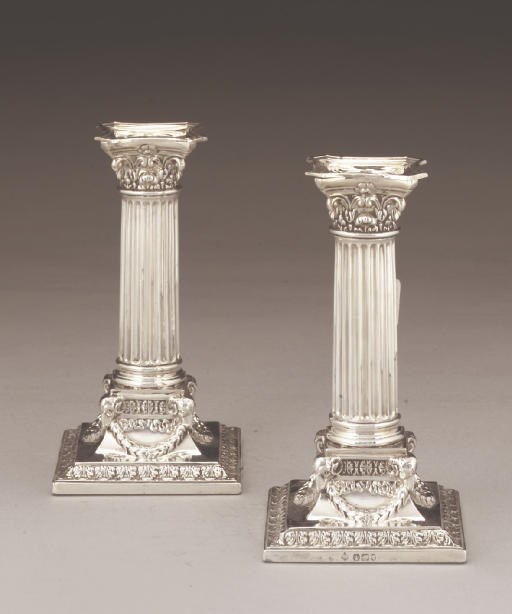 A PAIR OF EDWARDIAN NEO-CLASSICAL SILVER CANDLESTICKS