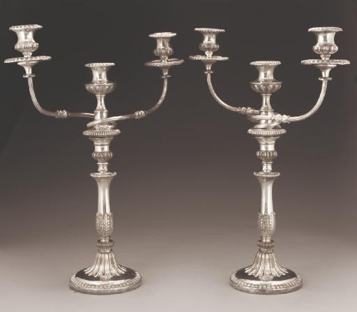 A PAIR OF OLD SHEFFIELD PLATE THREE-LIGHT CANDELABRA