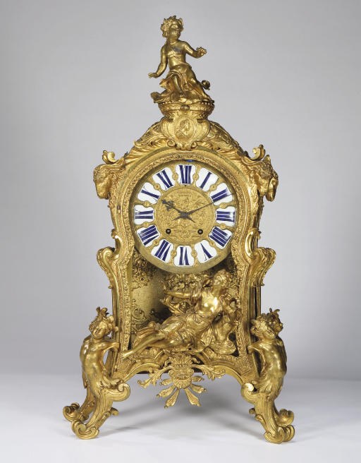 A REGENCE LACQUERED-BRONZE MANTEL CLOCK