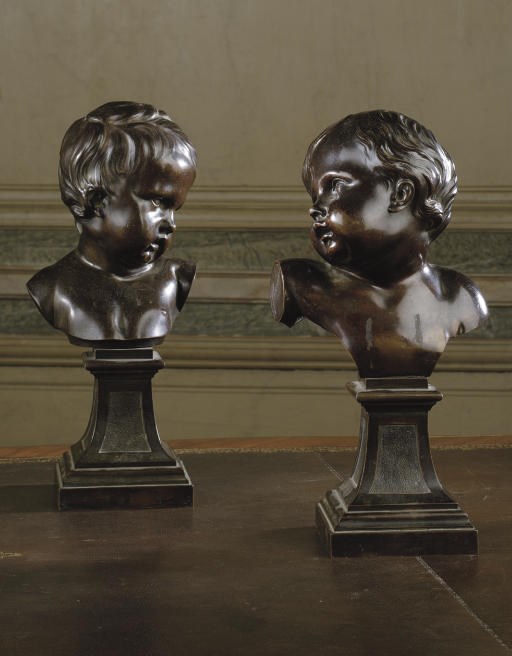 A PAIR OF BRONZE BUSTS OF YOUNG BOYS