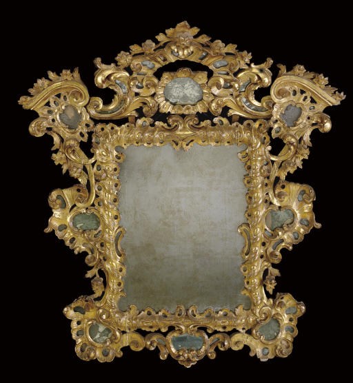 A SOUTH EUROPEAN GILTWOOD AND ETCHED GLASS MIRROR