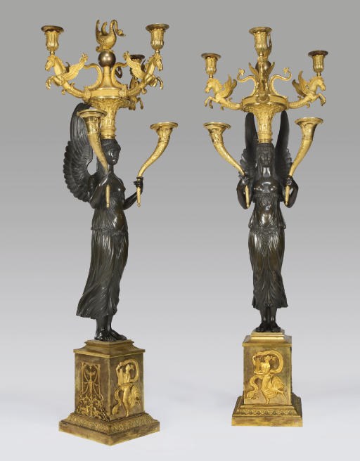 A PAIR OF EMPIRE ORMOLU AND PATINATED-BRONZE THREE-LIGHT CANDELABRA
