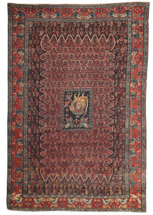 An unusual antique Senneh rug