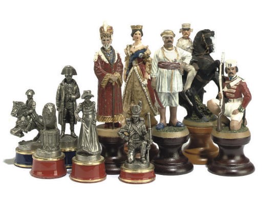 A CAST METAL ALLOY AND ENAMEL FIGURAL CHESS SET
