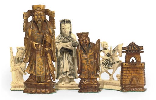 A CHINESE-EXPORT CARVED IVORY FIGURAL CHESS SET