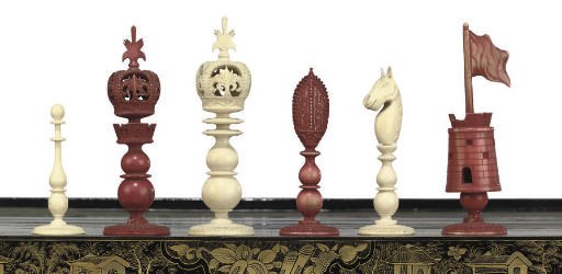 A CHINESE-EXPORT CARVED IVORY 'BURMESE' PATTERN CHESS SET
