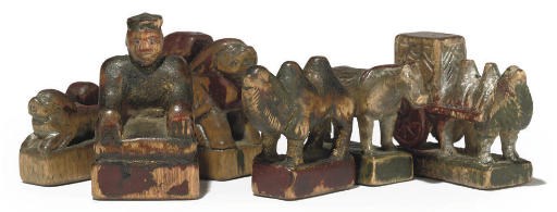 A MONGOLIAN POLYCHROME AND CARVED WOOD FIGURAL CHESS SET