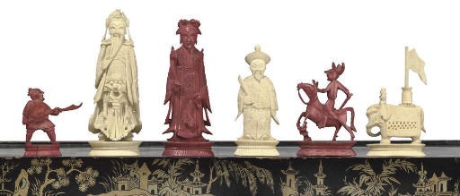 A CHINESE-EXPORT CARVED IVORY FIGURAL CHESS SET