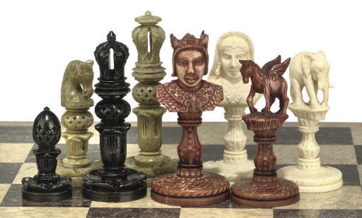 AN INDIAN CARVED IVORY 'SAHIB' TYPE CHESS SET