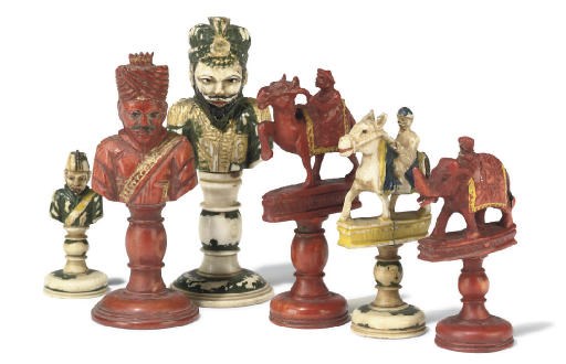 AN INDIAN GILT-HEIGHTENED POLYCHROME CARVED IVORY BUST TYPE CHESS SET