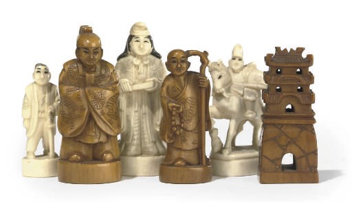 A JAPANESE CARVED IVORY FIGURAL CHESS SET