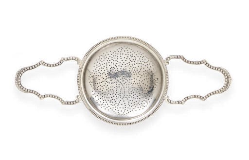 A GEORGE III SILVER PUNCH STRAINER