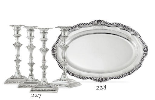 A SET OF FOUR GEORGE III SILVER CANDLESTICKS